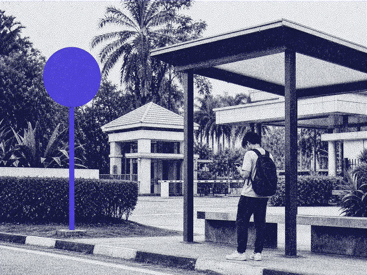 Signpost and shelter marking a fixed campus pickup point